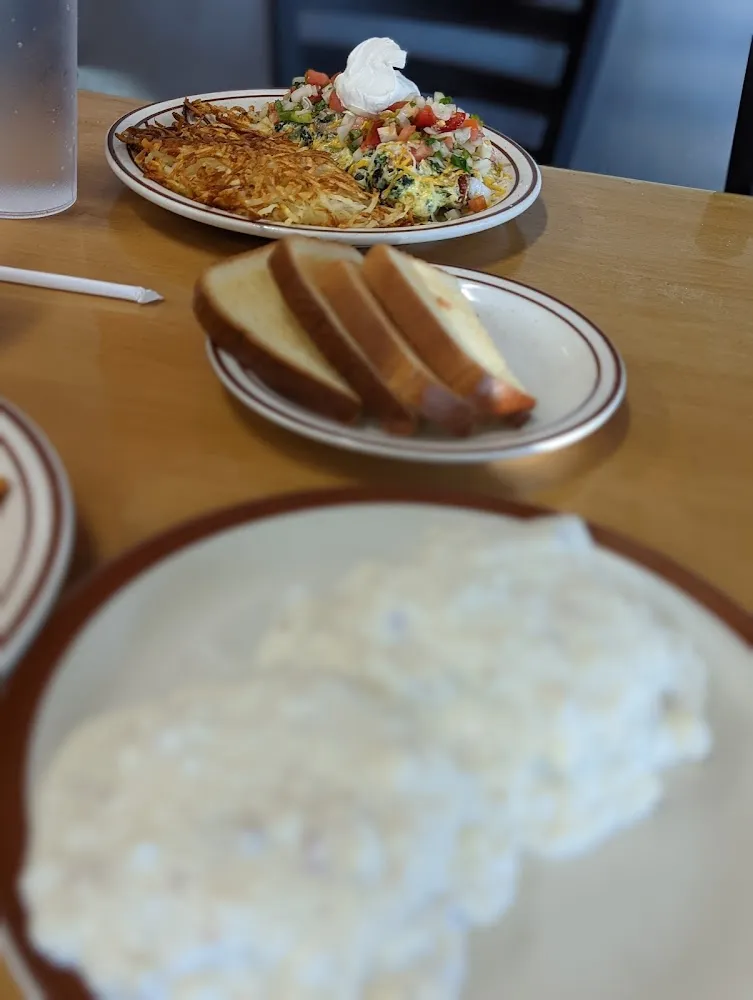 Biscuits and Gravy Fried Eggs Hash Browns and Bacon